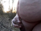 Chubby masturbates in the woods