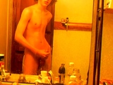 Curly-haired twink in bathroom