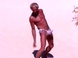 Tanned guy on beach in tiny string thong (temporarily!)