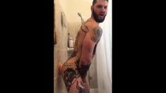 Tatted Hunk Fucks Dildo in Shower Until He Cums