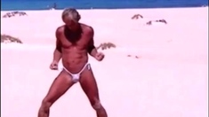 Tanned guy on beach in tiny string thong (temporarily!)