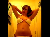 Cute girl records herself trying on bikinis for boyfriend